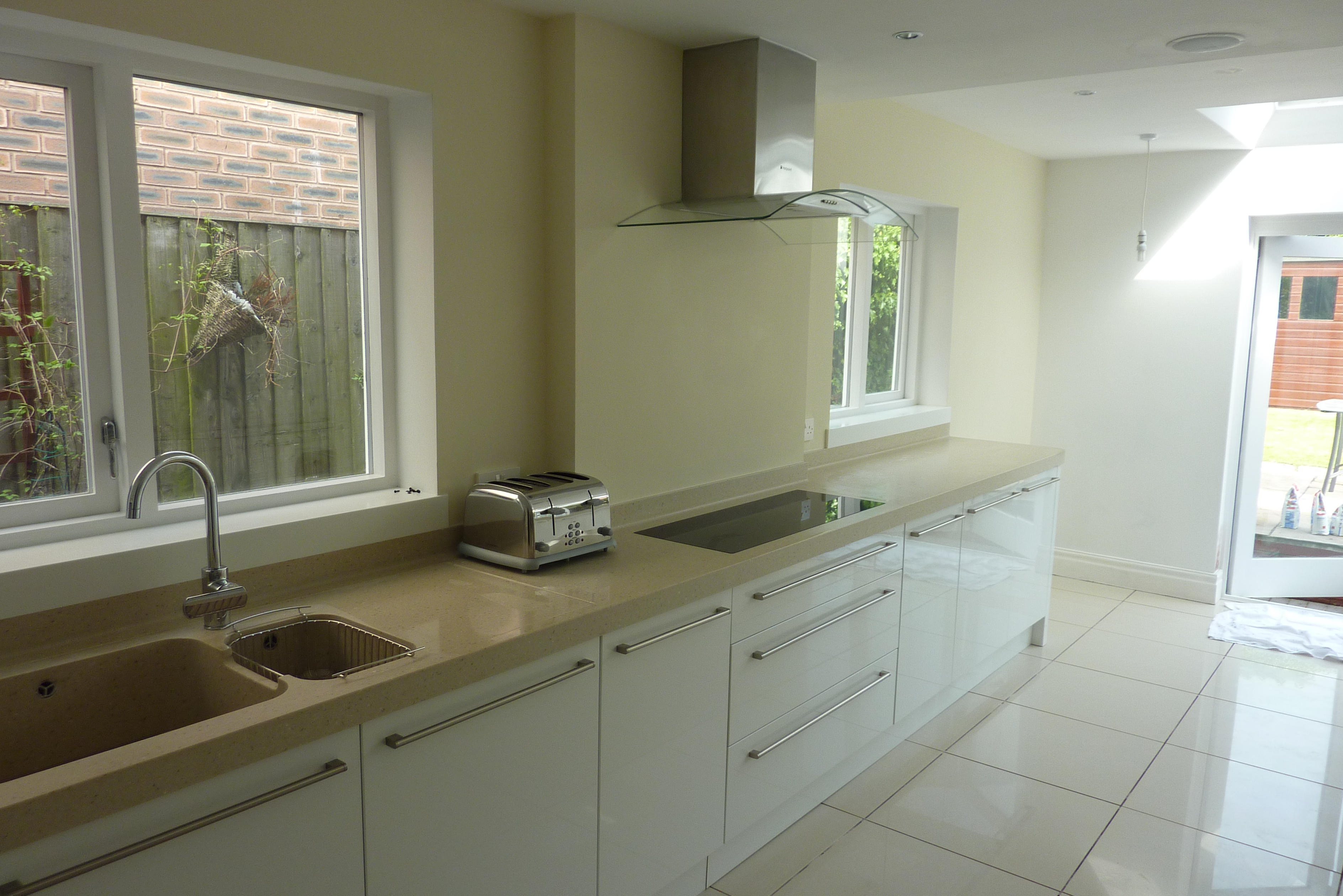 Corian worktops with coved up stands and inset corian sink and corian window sills